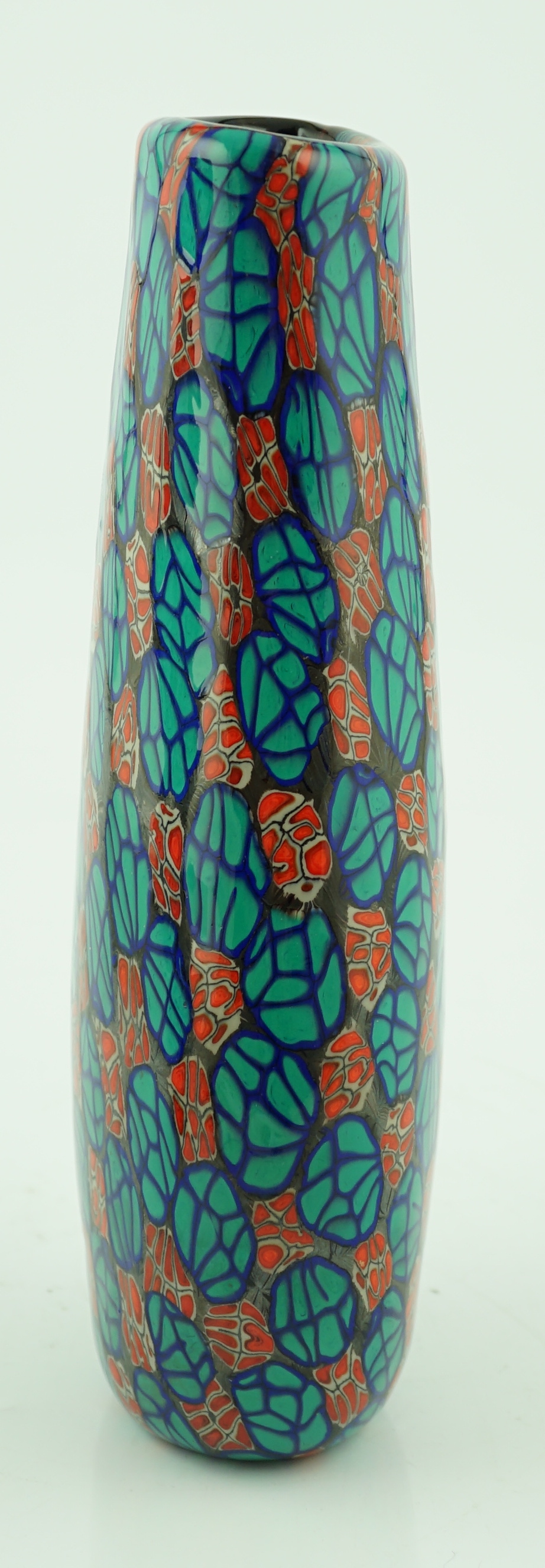 Vittorio Ferro (1932-2012) A Murano glass Murrine vase, the flattened oval baluster body, with a spiral design of red flowerheads and green leaves, on a blue ground, unsigned, 35cm, Please note this lot attracts an addit